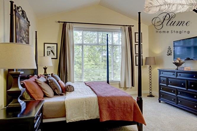 Clean vertical  lines accentuate high bedroom ceilings.